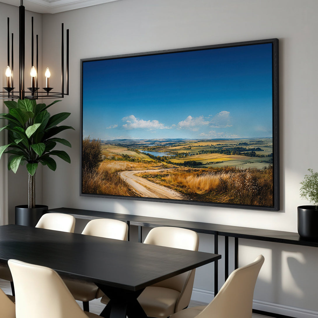 Framed Wall Art: Landscape Canvas Print with a winding road, blue sky, and warm color palette, perfect for living room or dining room decor.