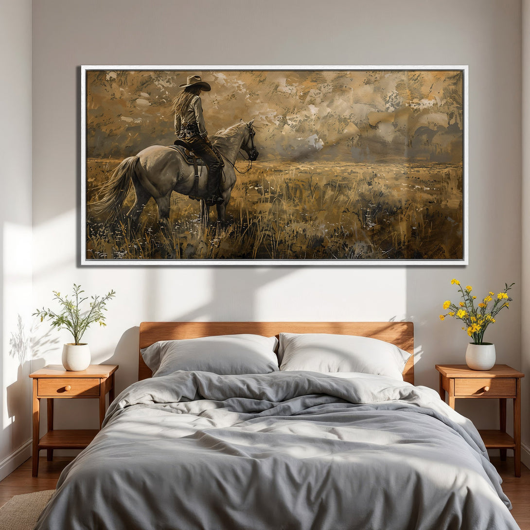 Framed Wall Art: Western-style painting of a cowgirl on horseback in a field. Warm, earthy color palette. Perfect for bedroom decor.