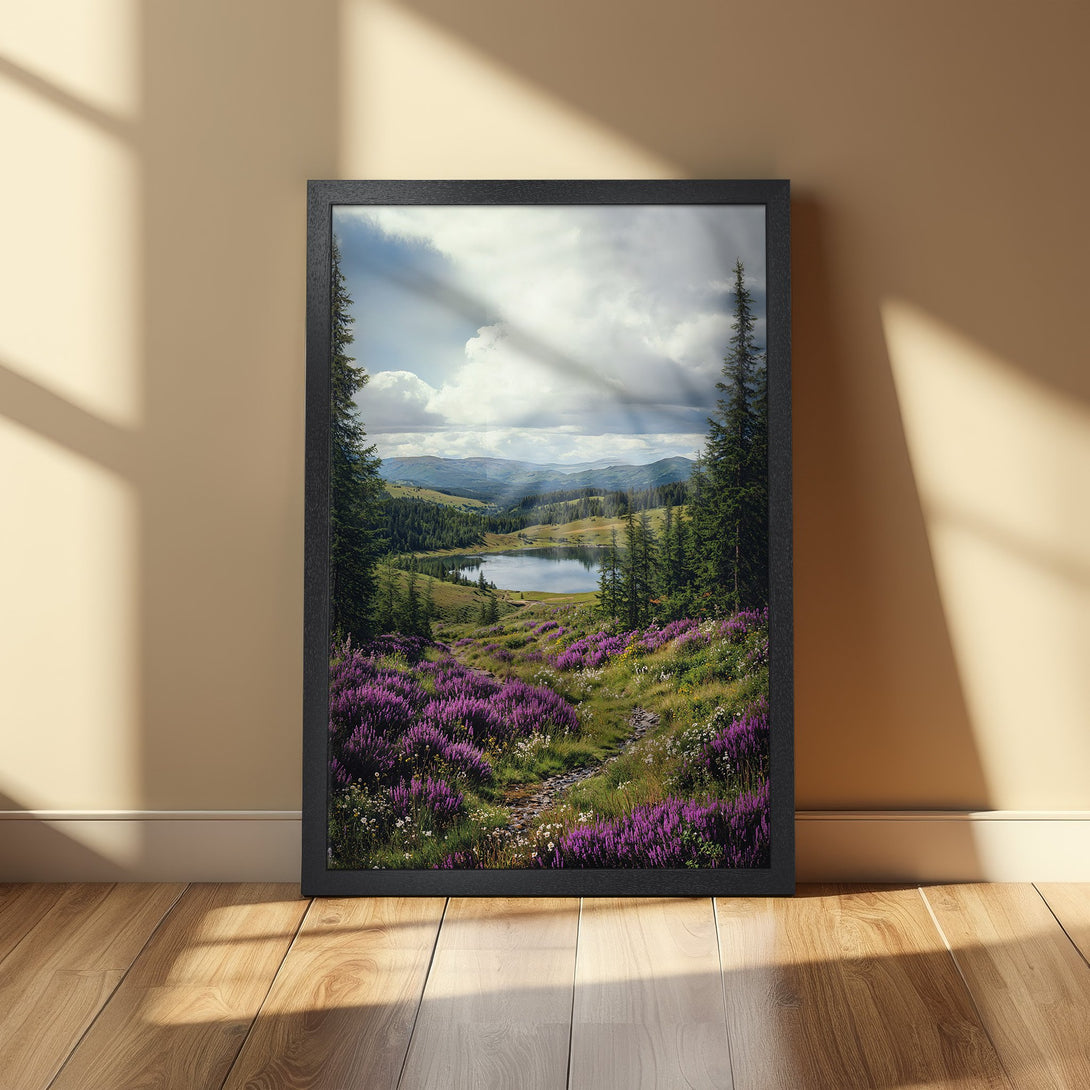 Scenic Framed Poster: Mountain landscape print with vibrant purple flowers, green trees, and a lake, in a black frame. Warm color palette.