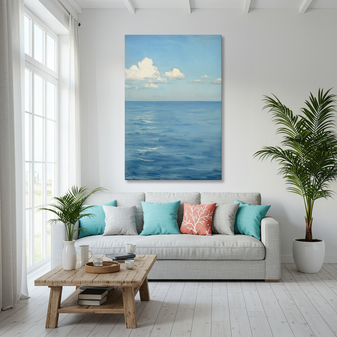 Framed Wall Art featuring a serene ocean landscape in blue and white, displayed in a coastal-style living room. Perfect for adding a touch of tranquility.
