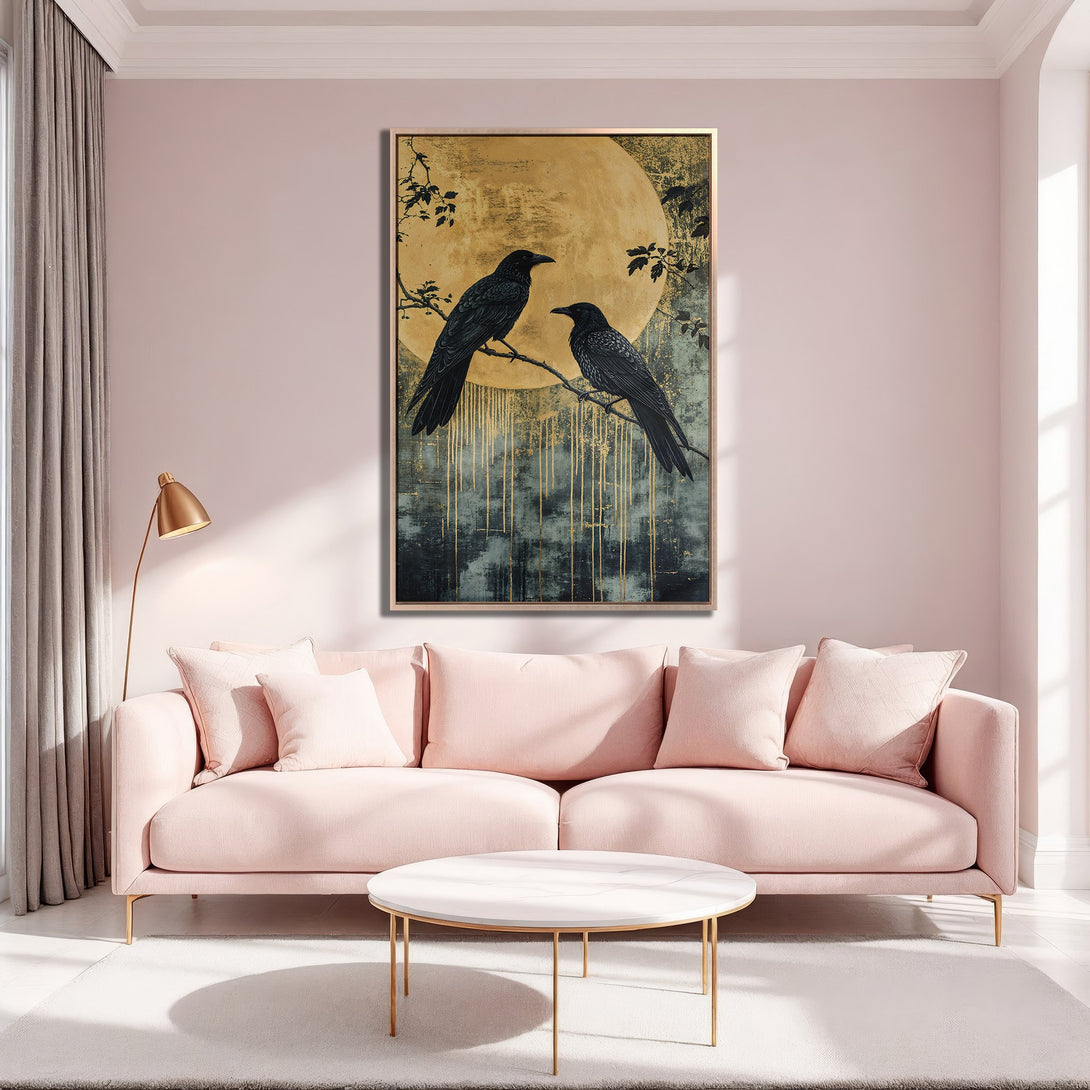 Framed Wall Art featuring two black crows on a branch with a golden moon, in a modern, abstract style. Soft pink and gold color palette, perfect for any interior.