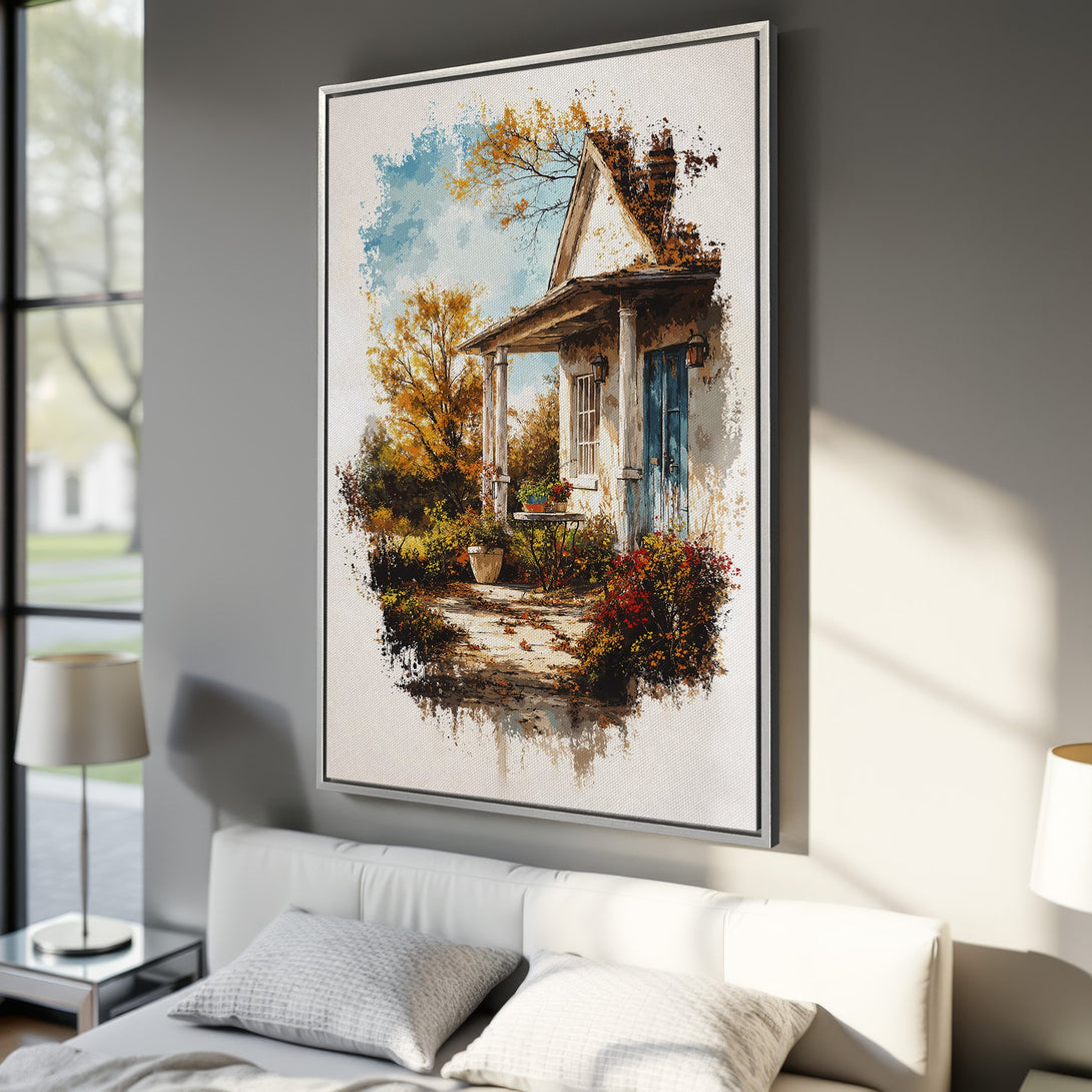 Framed Wall Art: Watercolor painting of a charming cottage in autumn hues. Warm orange, blue, and green tones create a cozy, inviting atmosphere. Perfect home decor.