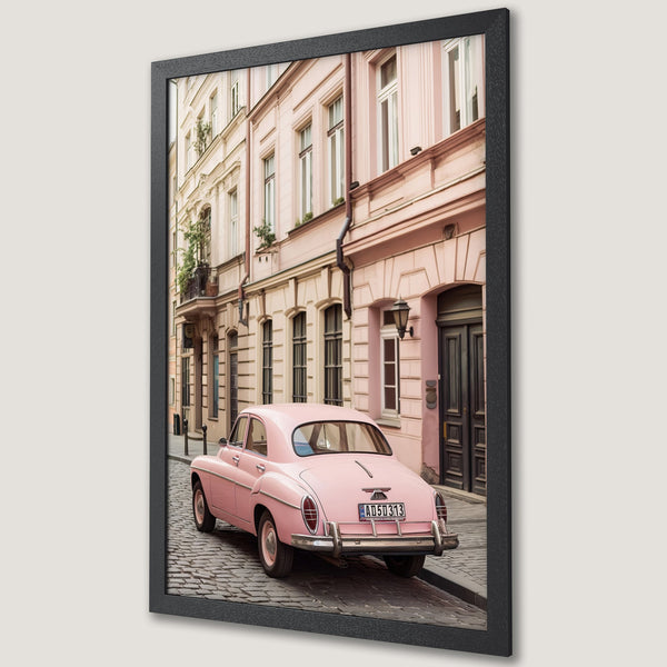 Framed Poster featuring a vintage pink car parked on a cobblestone street. Pastel color palette with a European, romantic style. Perfect wall art!