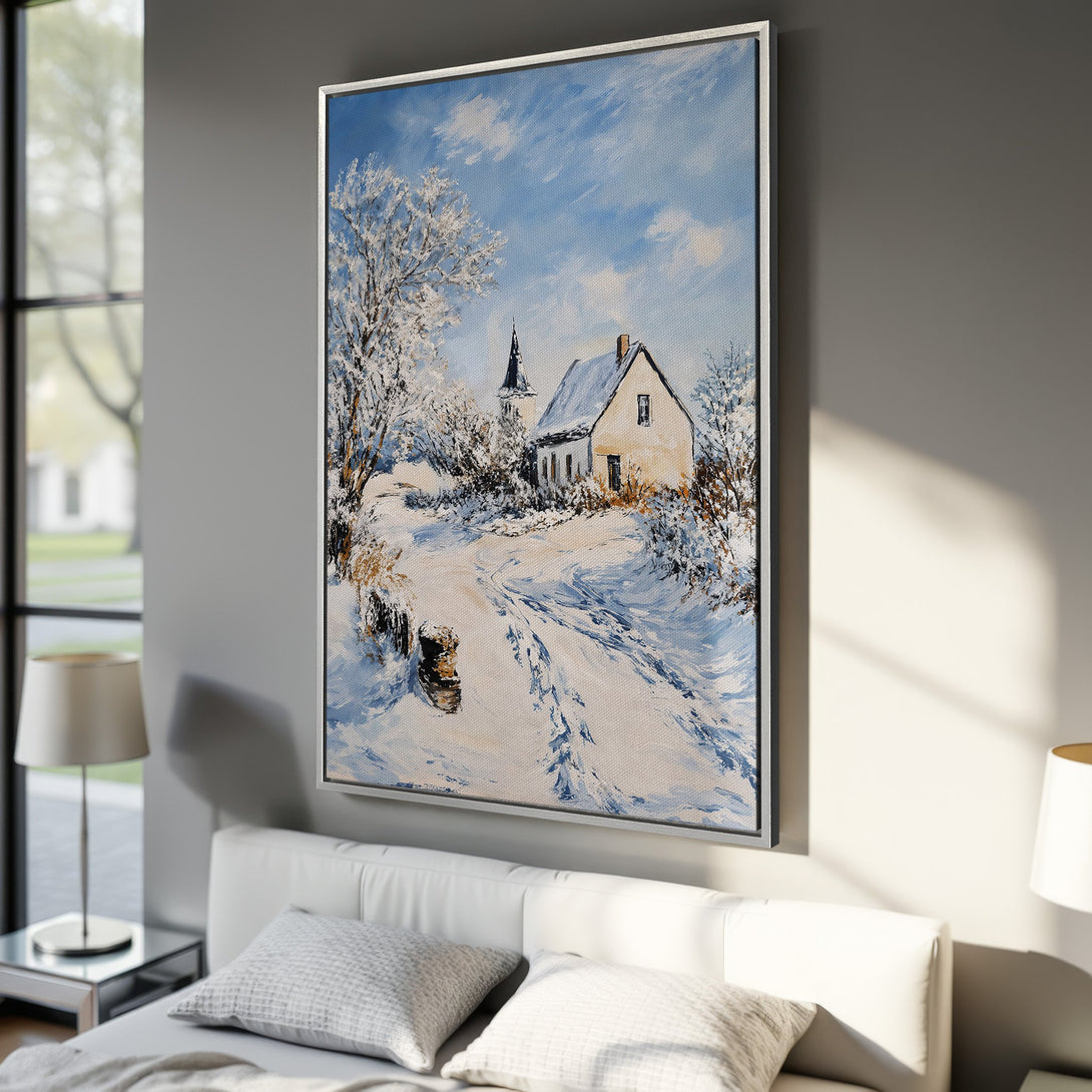 Framed Wall Art of a winter landscape painting with a house and church. Blue, white, and brown color palette. Perfect for cozy home decor.