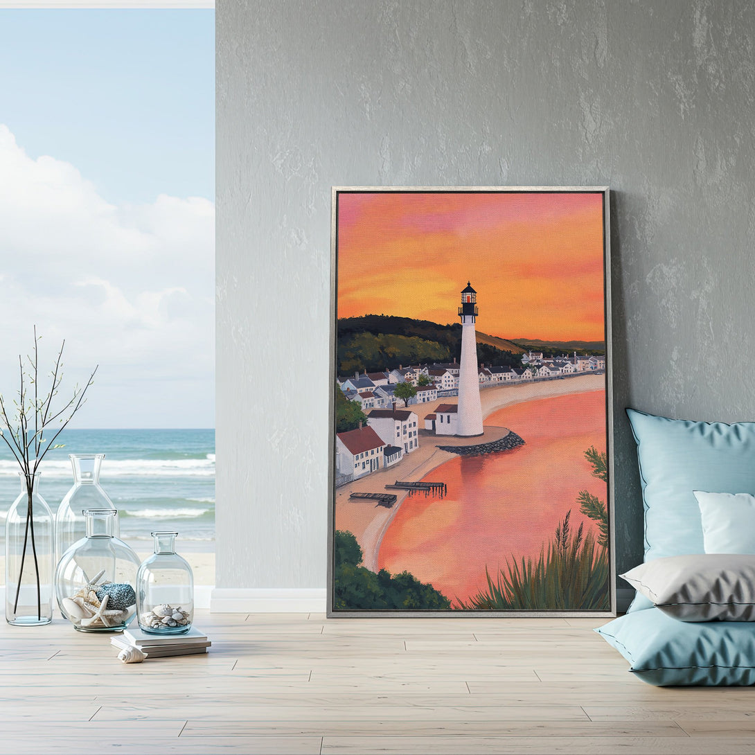 Framed Wall Art: Coastal lighthouse painting with warm sunset hues. Perfect for beach house decor. Add a touch of serenity to your space.