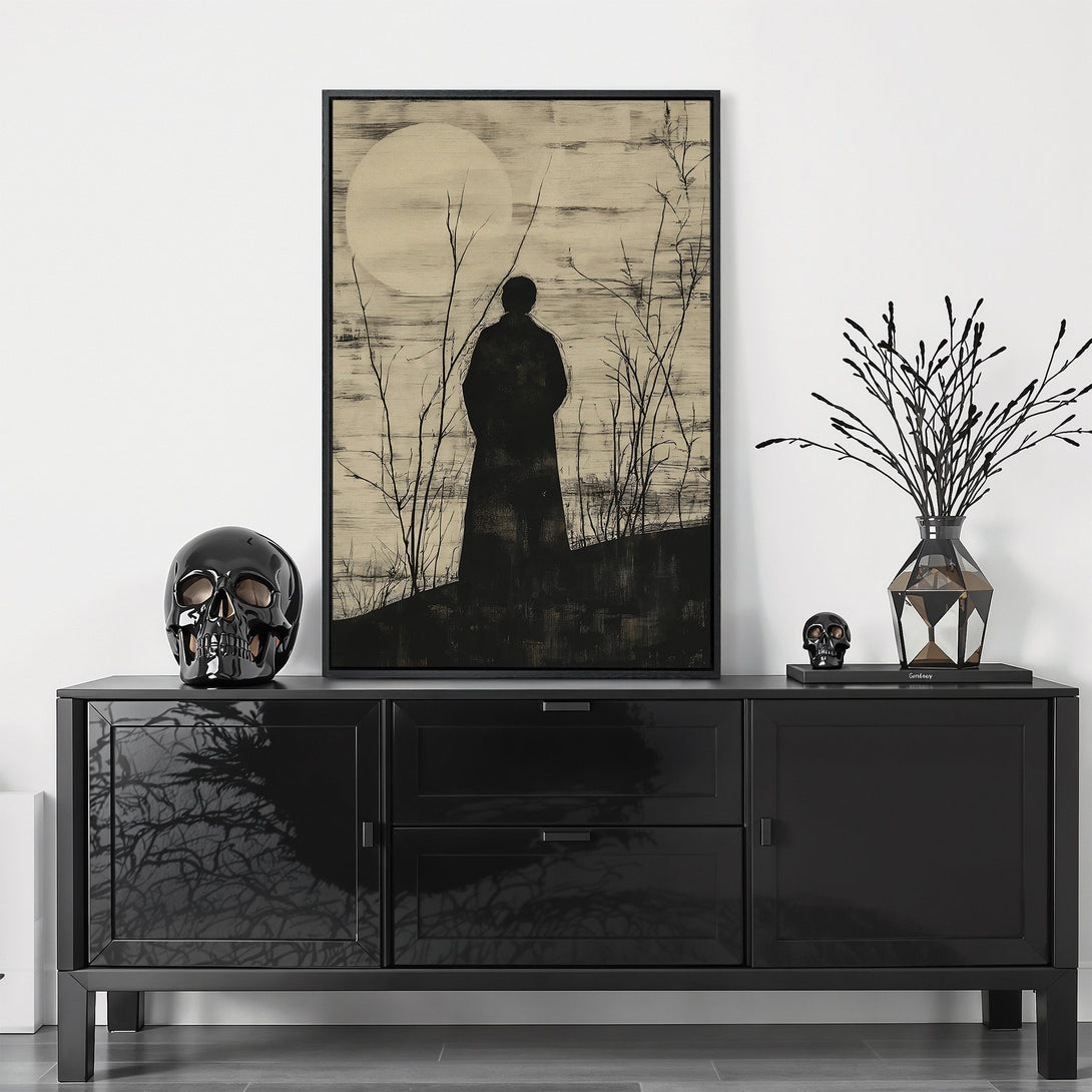 Framed Wall Art featuring a silhouette figure under a moon, in a minimalist, monochrome style. Perfect for adding a touch of mystery to your space.