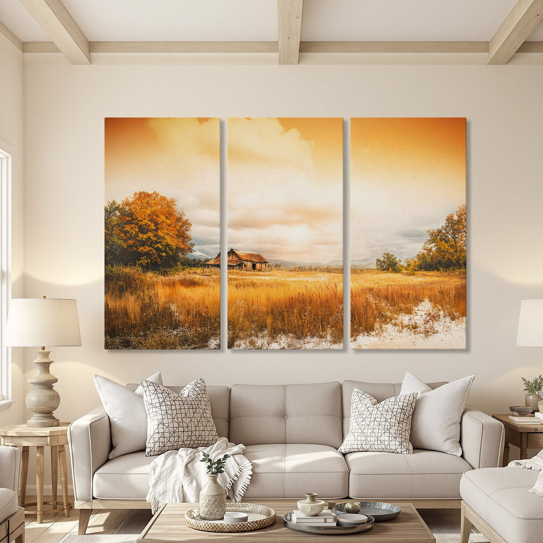 Canvas Print triptych of a rustic barn landscape in warm orange and gold tones. Perfect for adding a touch of nature to your home decor.