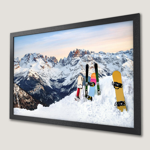 Framed Poster featuring a snowy mountain landscape with skis and snowboards. Earthy tones and a modern style. Perfect wall art!