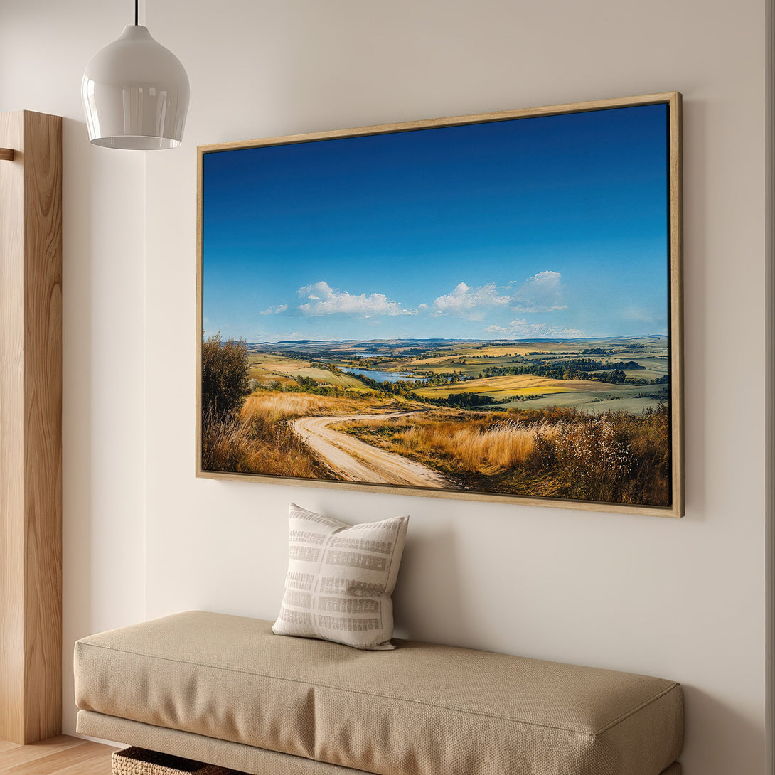 Framed Wall Art: Landscape Canvas Print with a scenic view, featuring a dirt road, blue sky, and warm earth tones. Perfect for home decor.