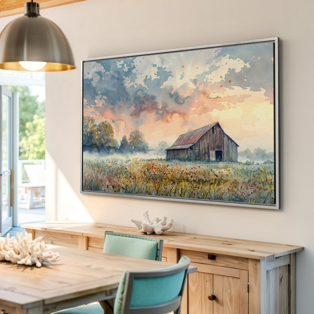 Framed Wall Art: Watercolor barn scene Canvas Print. Rustic landscape art with warm sunset hues and a touch of blue. Perfect for farmhouse decor.