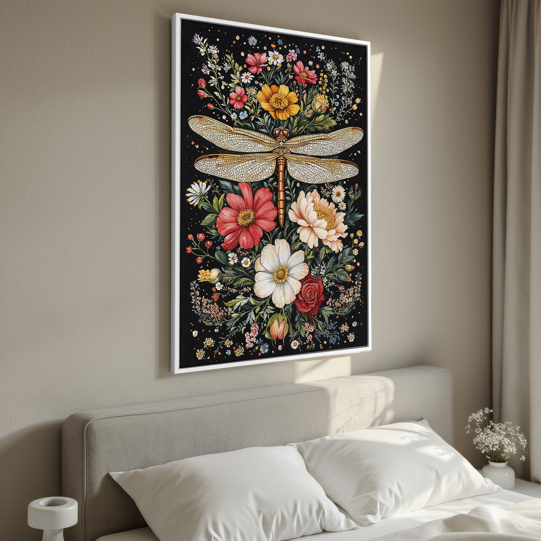 Framed Wall Art: Dragonfly & floral Canvas Print in a bedroom. Features a black background, vibrant flowers, and warm color palette. Perfect home decor.