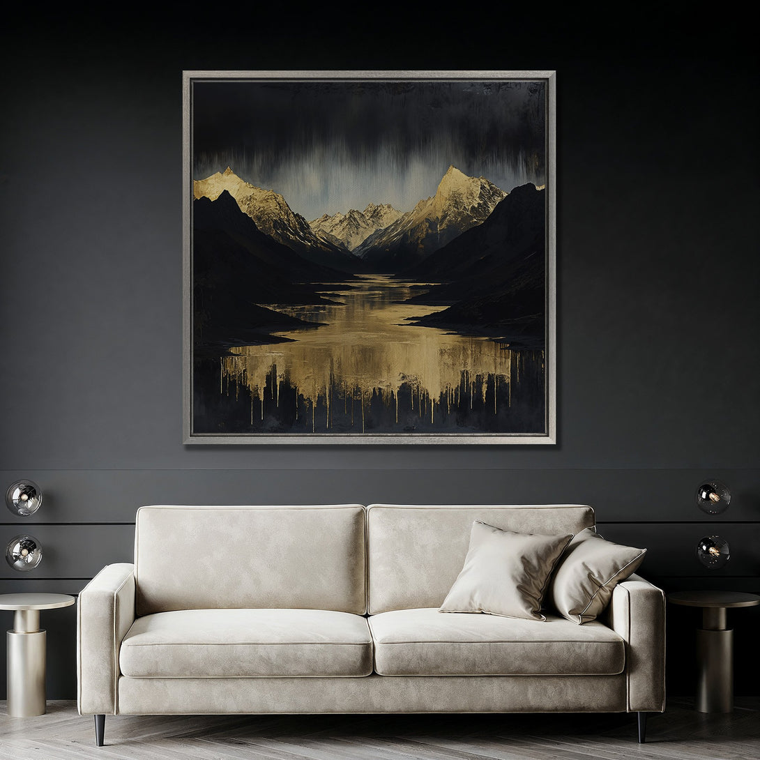 Framed Wall Art featuring a mountain landscape in a dark, moody style with gold and black tones, displayed above a sofa in a modern interior.