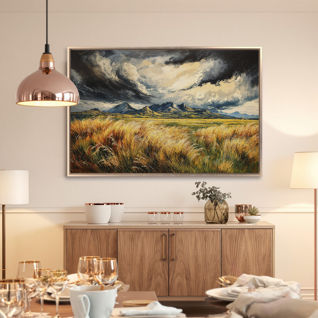 Framed Wall Art: Dramatic landscape Canvas Print with moody sky, golden field, and mountain range. Earthy tones for a cozy interior.