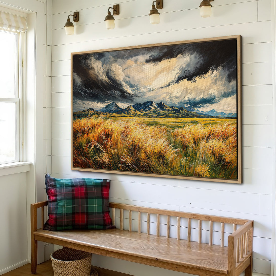 Framed Wall Art: Landscape painting of mountains & tall grass with a dramatic sky. Earthy tones of gold, blue, and brown. Perfect for home decor.