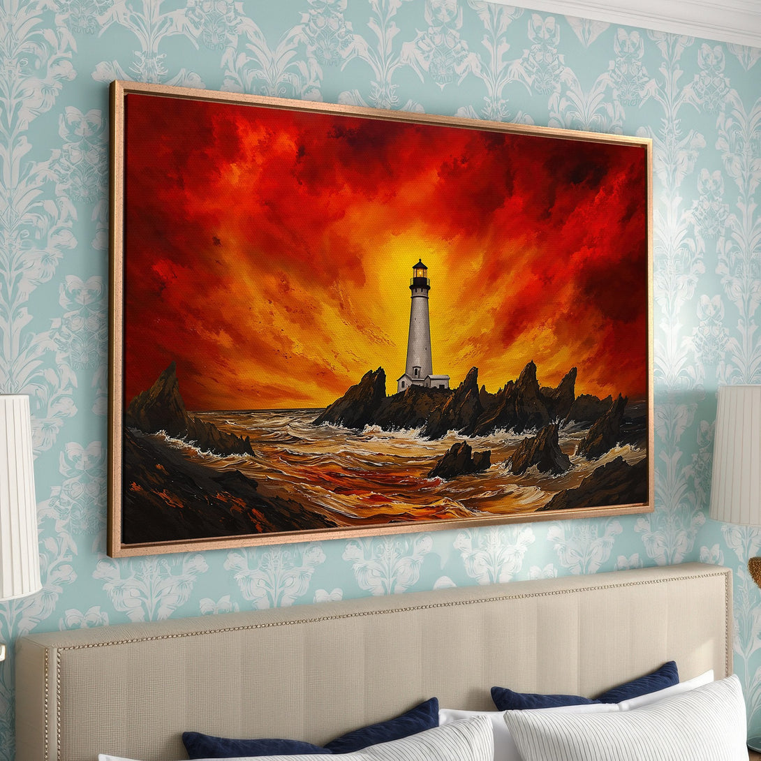 Framed Wall Art: Lighthouse painting with fiery sunset. Dramatic coastal scene in warm red, orange, and yellow hues. Perfect for adding art to your home!