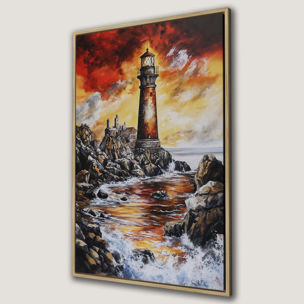 Framed Wall Art: Lighthouse painting with fiery sunset. Coastal artwork in warm orange, red, and yellow tones. Perfect for adding a dramatic touch to any space.