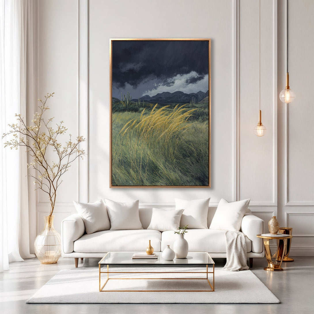 Framed Wall Art: Dramatic landscape canvas print in a modern interior. Features a moody sky, golden grass, and a muted color palette. Elevate your home decor!