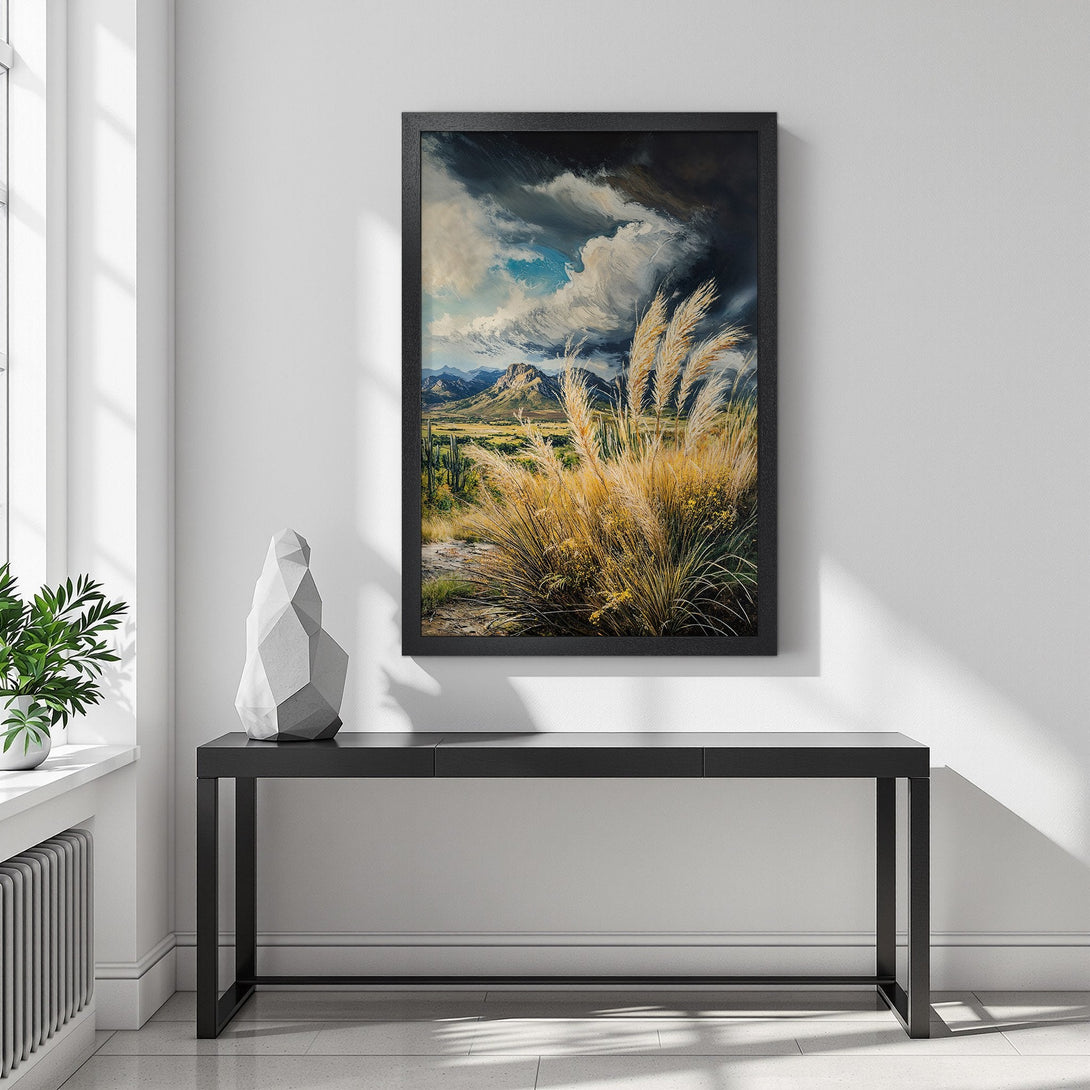 Framed Poster featuring a landscape painting with a dramatic sky and golden grasses. Earthy tones and a touch of blue create a serene aesthetic.