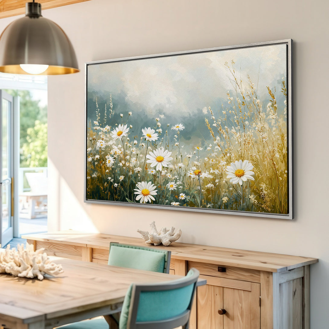 Framed Wall Art: Daisy field canvas print in a neutral interior. Soft, impressionistic style with white, yellow, and green tones. Perfect for a calming space.