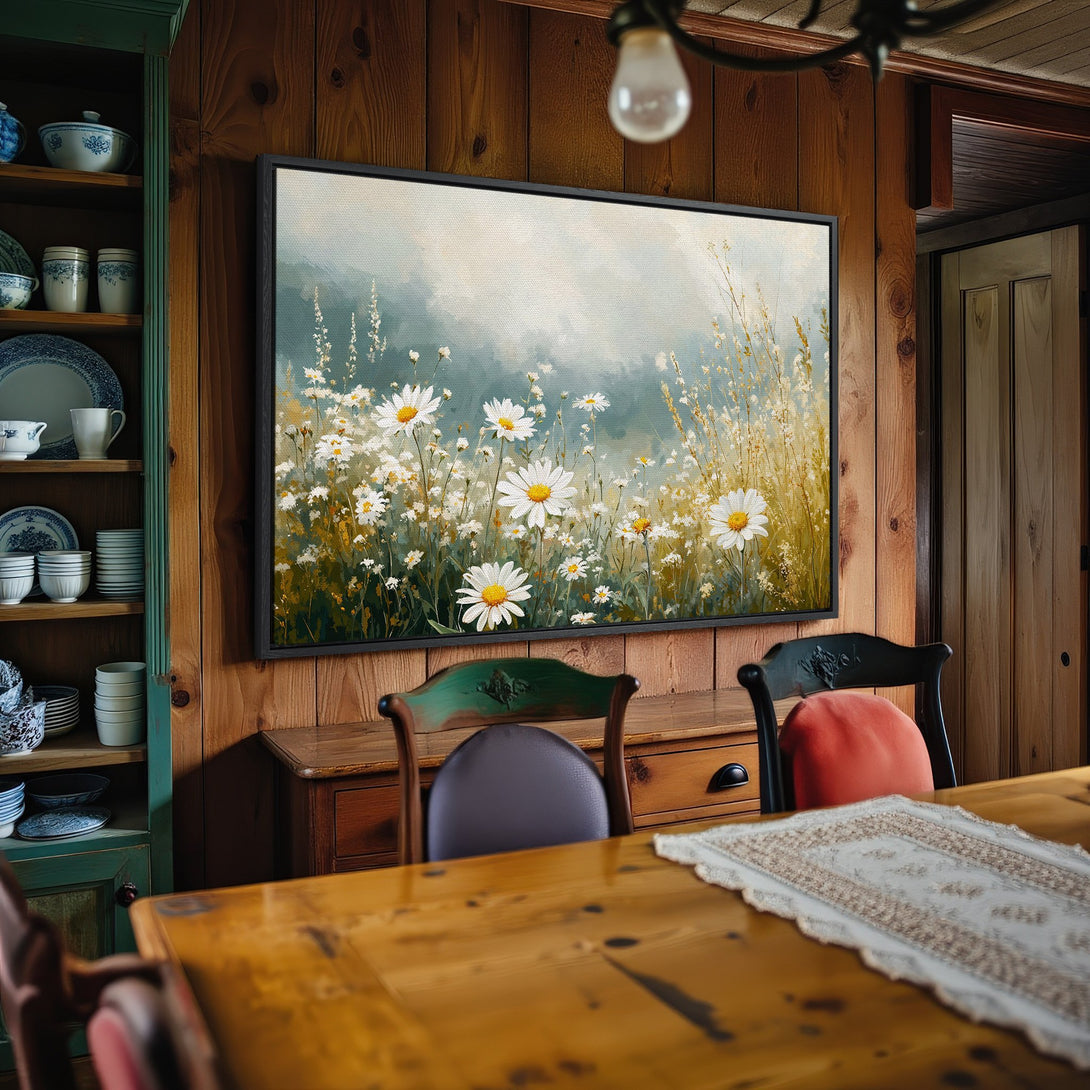 Framed Wall Art: Daisy field canvas print in a rustic interior. Soft, neutral color palette with pops of white, yellow, and green. Perfect for farmhouse decor.