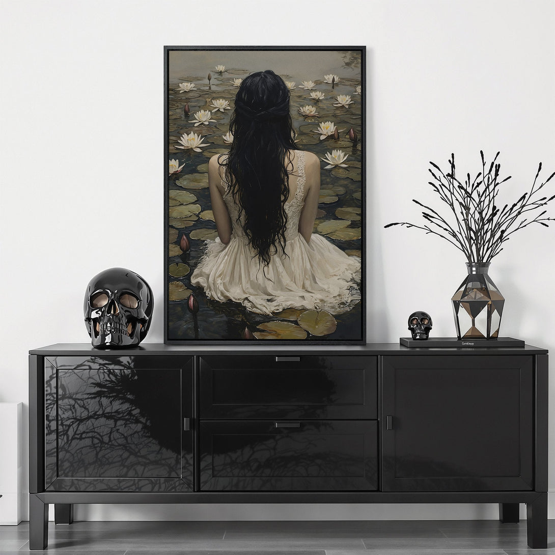 Framed Wall Art featuring a woman on a lake, serene and elegant. Neutral color palette with black frame, perfect for modern home decor.