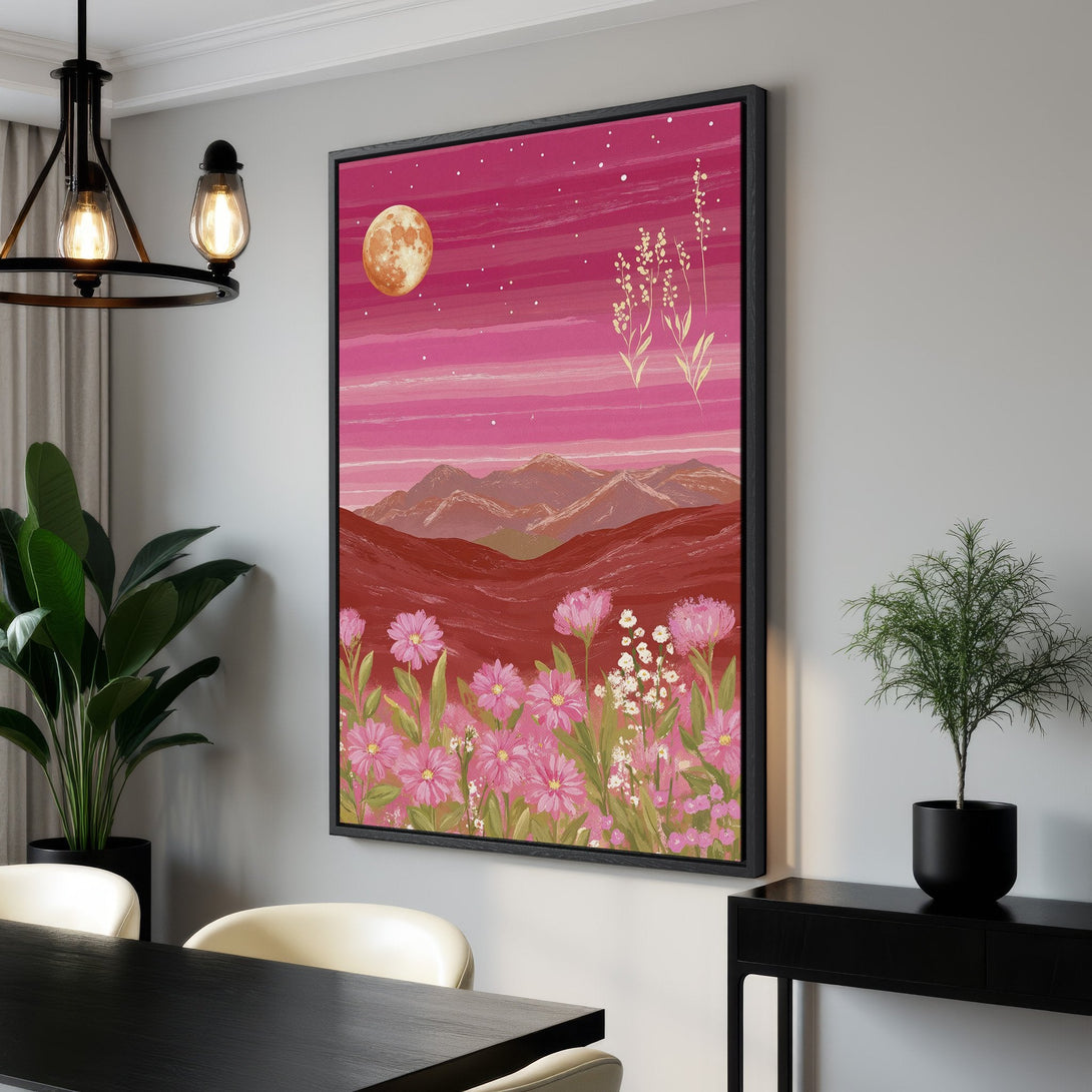 Framed Wall Art featuring a vibrant pink landscape with a full moon and floral elements. Adds a pop of color to any space, perfect for modern decor.