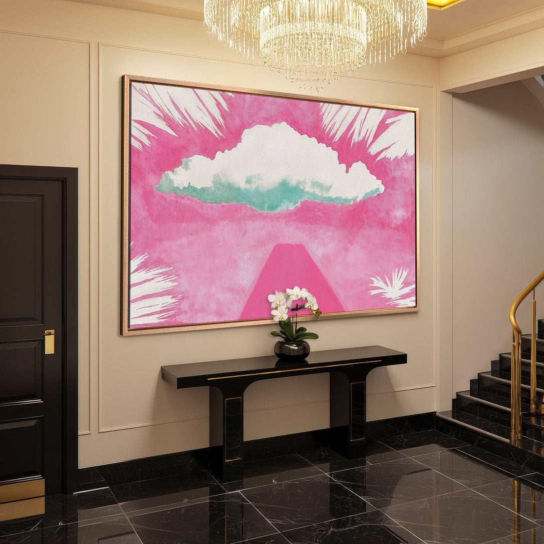 Framed Wall Art: Abstract pink cloud painting adds a pop of color to a modern entryway. Watercolor style canvas print with a gold frame.
