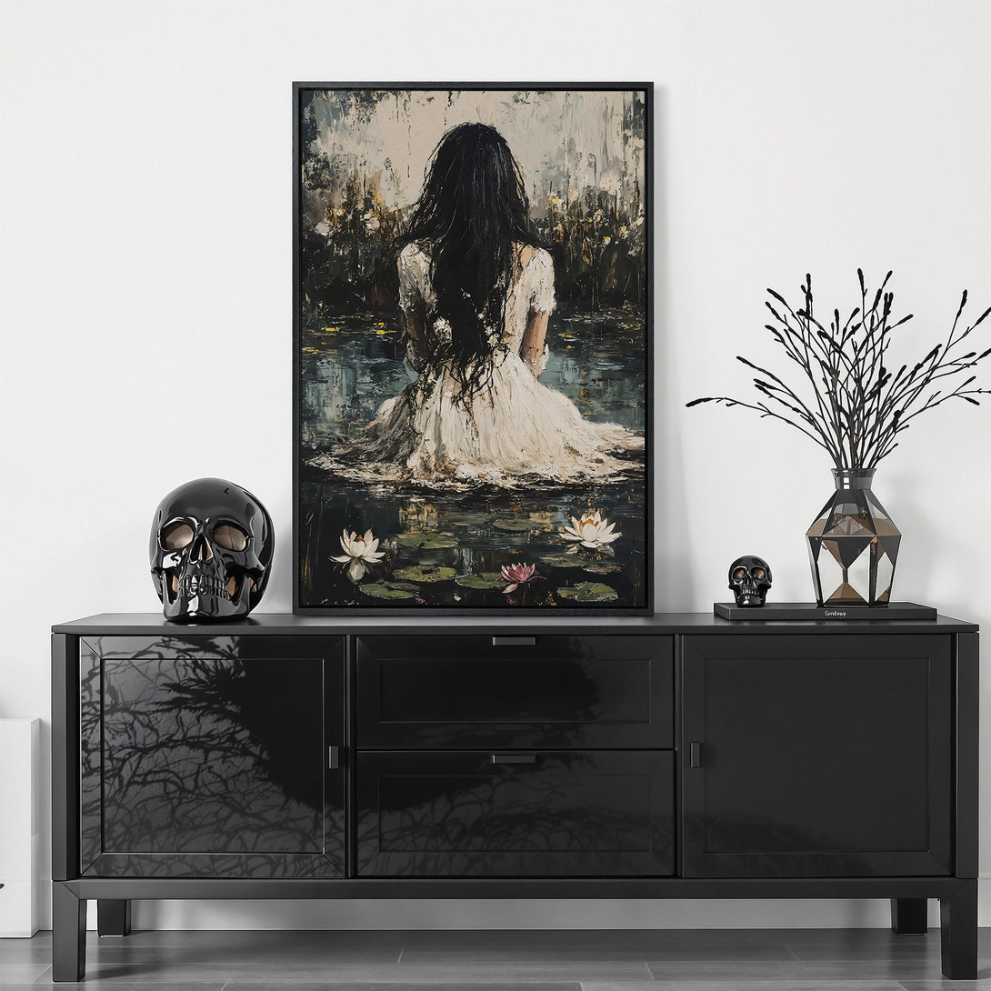 Framed Wall Art featuring a woman in a pond, impressionist style, with a muted color palette of blacks, whites, and greens. Perfect for modern decor.