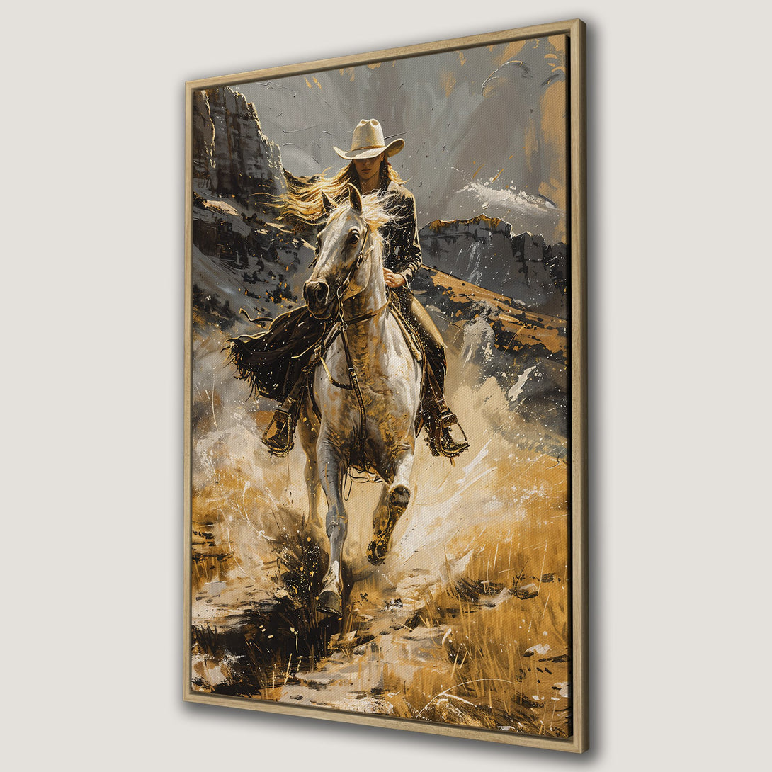 Framed Wall Art featuring a cowgirl on horseback in a dynamic, painterly style. Earthy tones of gold, gray, and brown create a captivating Western landscape.