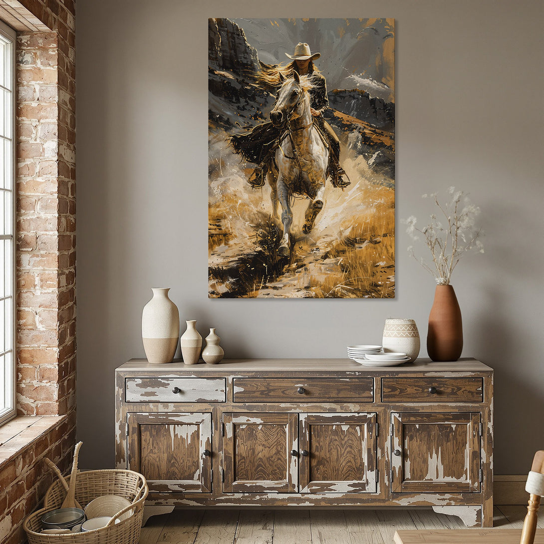 Framed Wall Art: Cowgirl on Horseback. Dramatic painting in warm gold, gray, and white tones. Perfect for adding rustic elegance to your dining room.