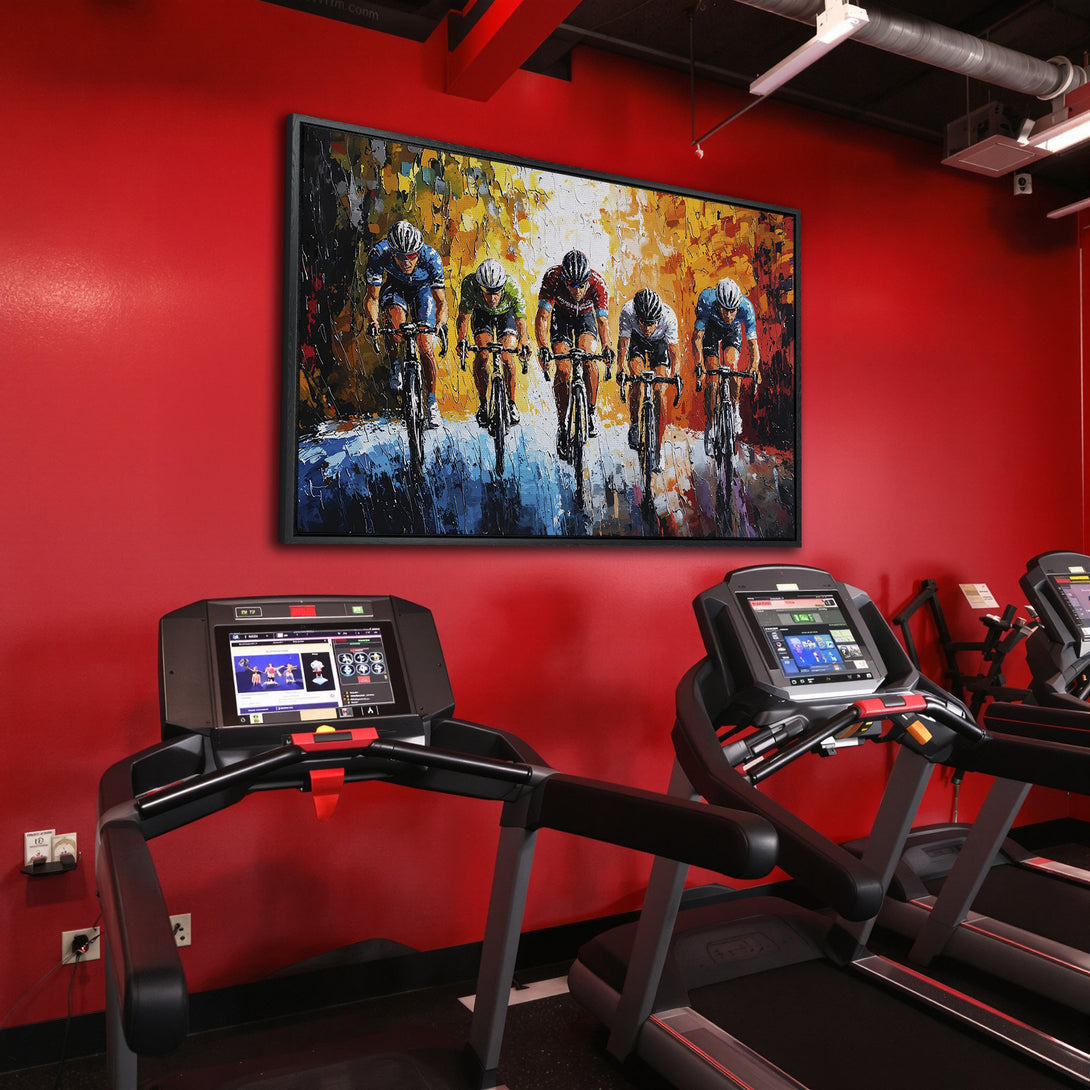 Framed Wall Art of cyclists in action. Vibrant oil painting style with a warm, yellow, blue, and red color palette. Perfect for home or gym decor.
