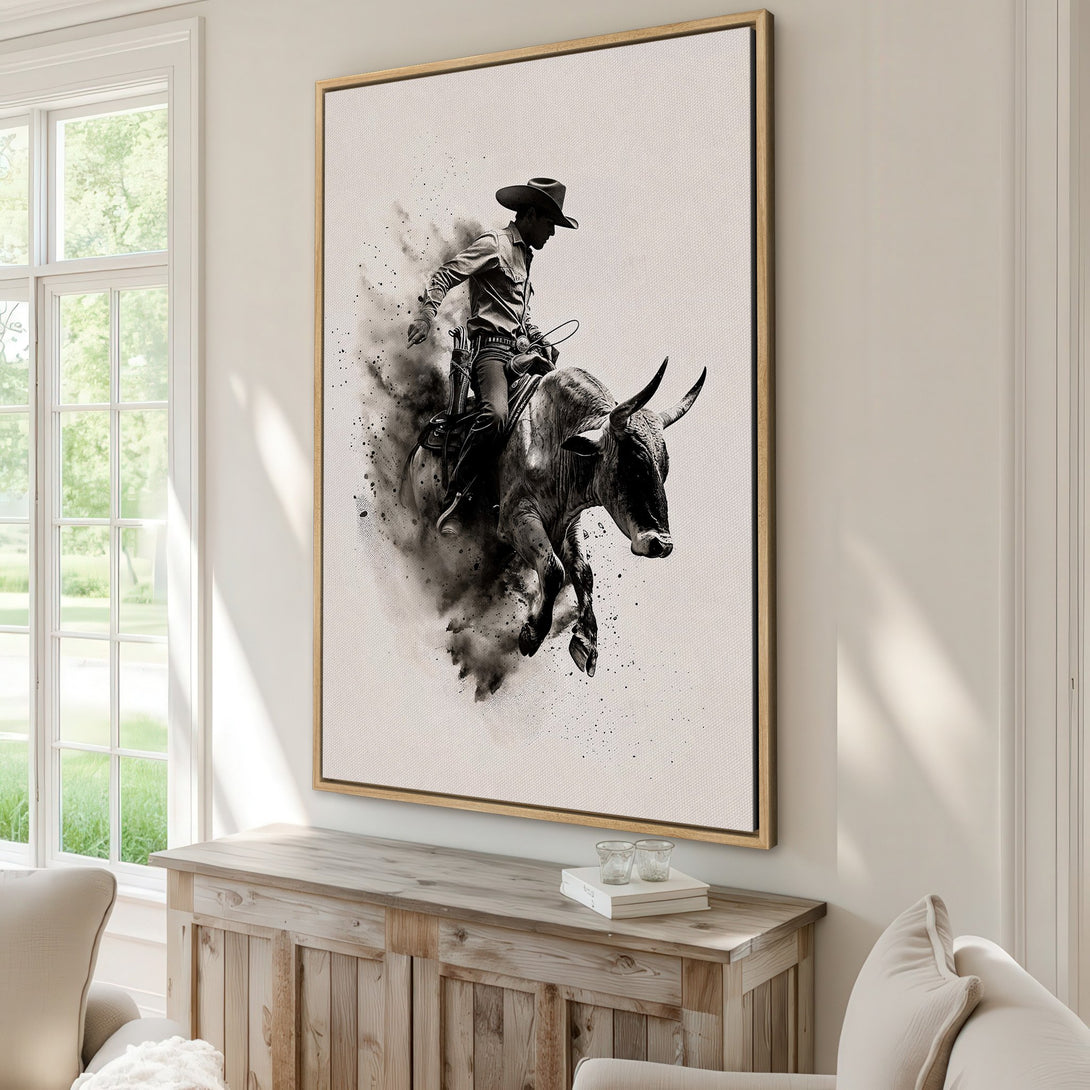 Framed Wall Art: Cowboy riding a bull, monochrome artwork. Rustic style canvas print with a neutral color palette, perfect for western decor.
