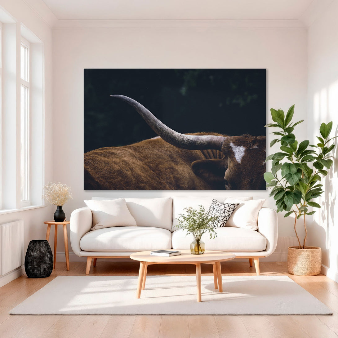 Framed Wall Art: Texas Longhorn Canvas Print in a luxury interior. Rustic brown and gold tones create a sophisticated, inviting atmosphere.
