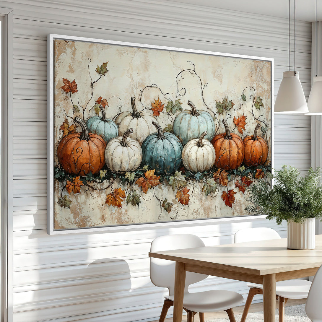 Framed Wall Art: Autumn pumpkins in warm orange, cream, and teal hues. Rustic canvas print perfect for fall decor. Enhance your dining room with this artwork.