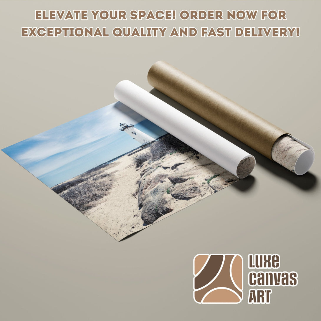 Lighthouse Poster Roll with blue sky & sand, neutral tones. Elevate your space with Luxe Canvas Art!