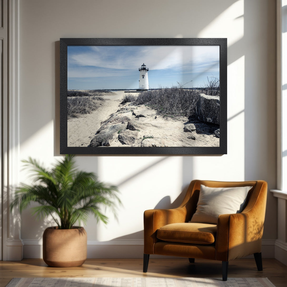 Framed Poster of a lighthouse on a beach, serene landscape art in a black and white style with blue sky, perfect for home decor.