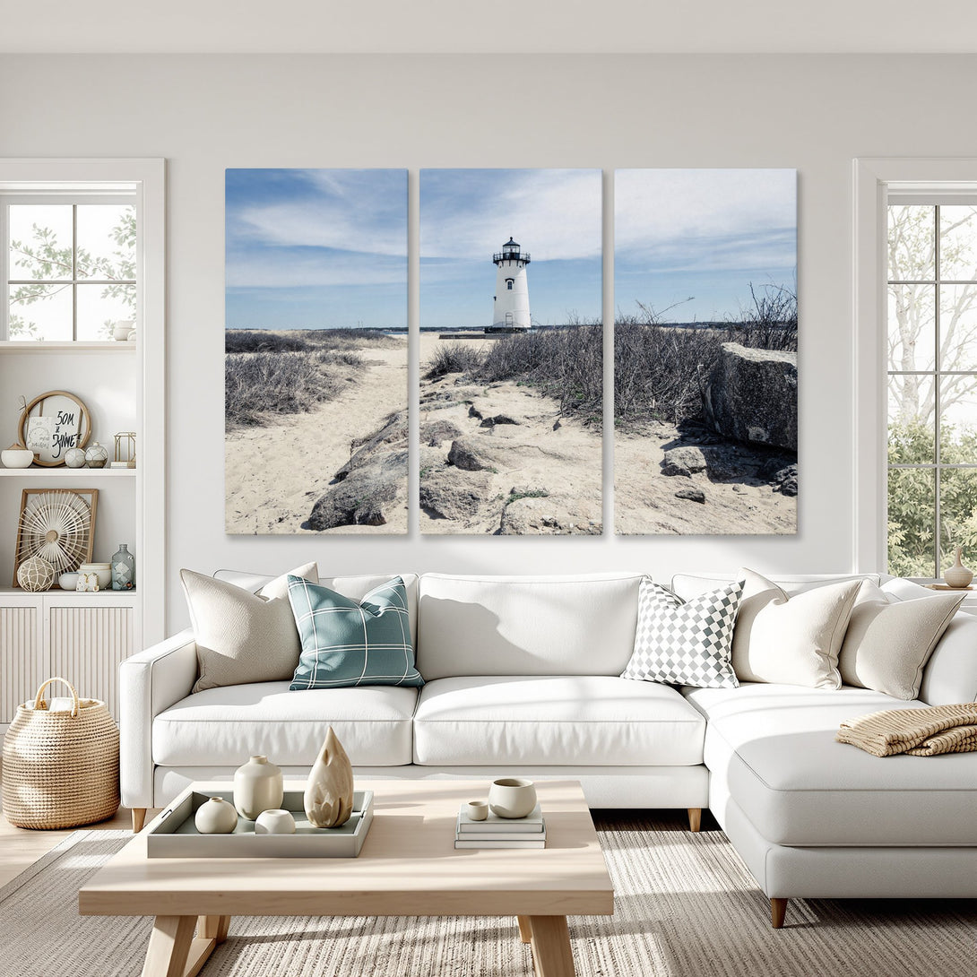 Canvas Print of a lighthouse on a beach, coastal style art with a neutral and blue color palette, perfect for a living room.