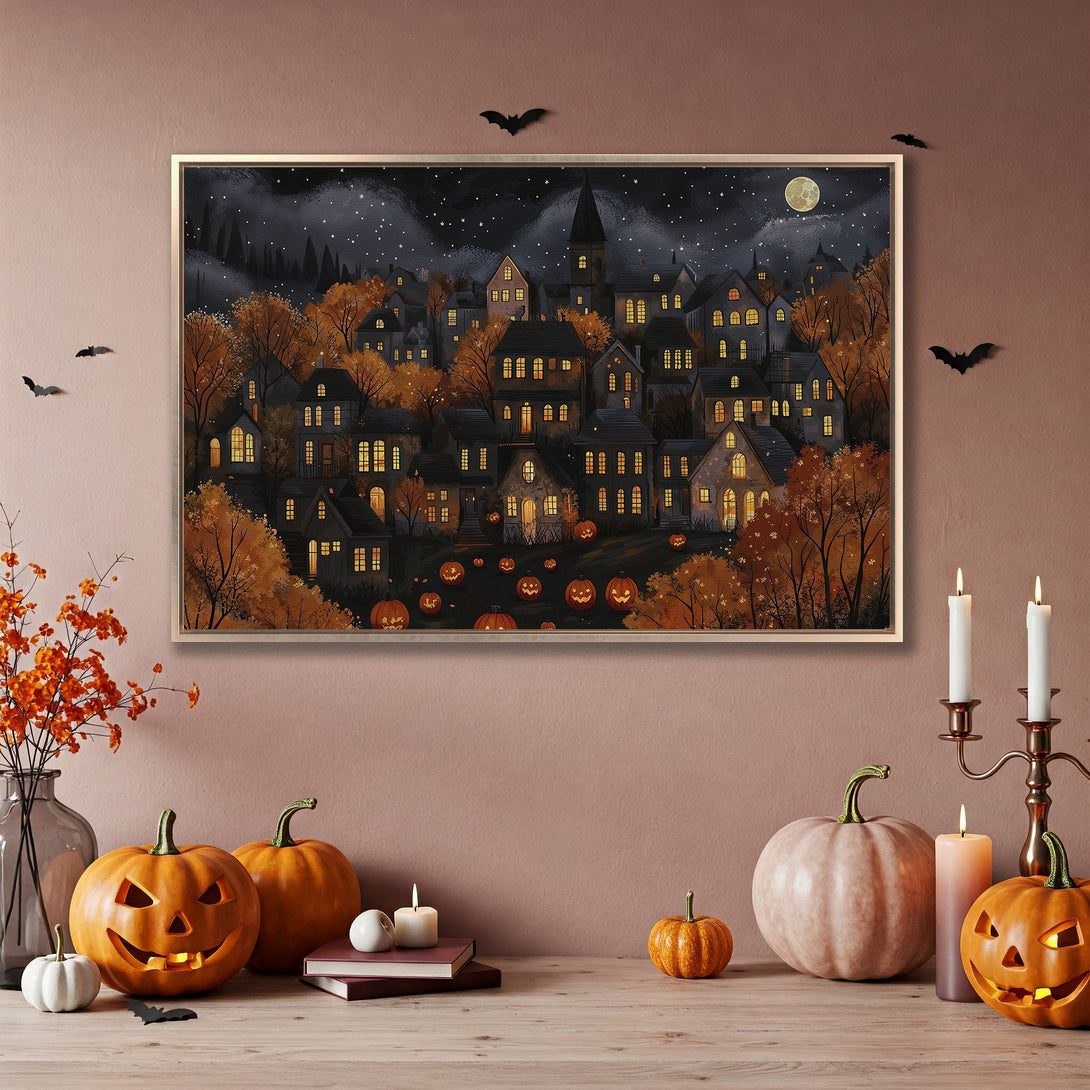 Framed Wall Art: Spooky Halloween village scene in warm autumn tones. Perfect fall decor! Canvas Print adds cozy charm to any space.