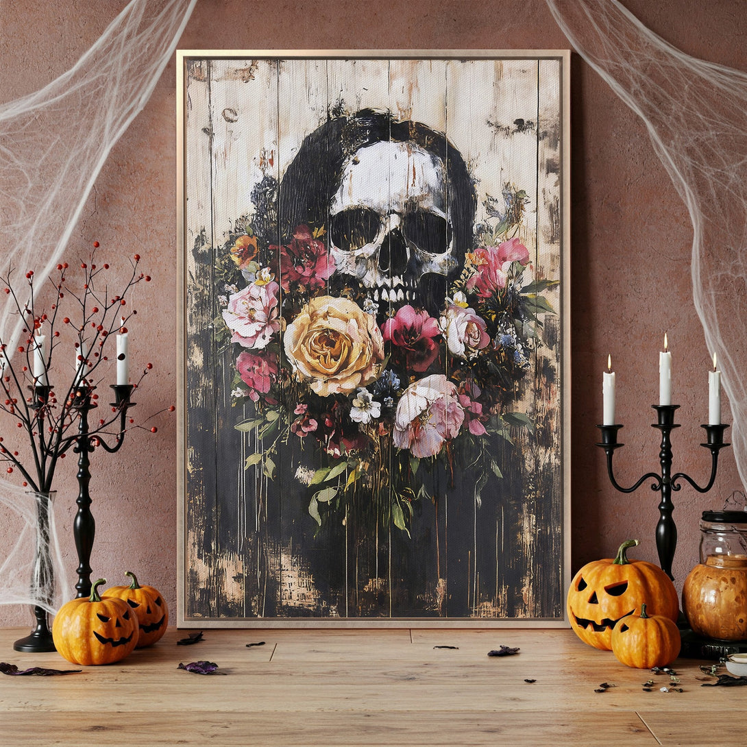 Framed Wall Art featuring a skull and floral design. Moody, dark color palette with pops of red, pink, and yellow. Perfect Halloween decor!