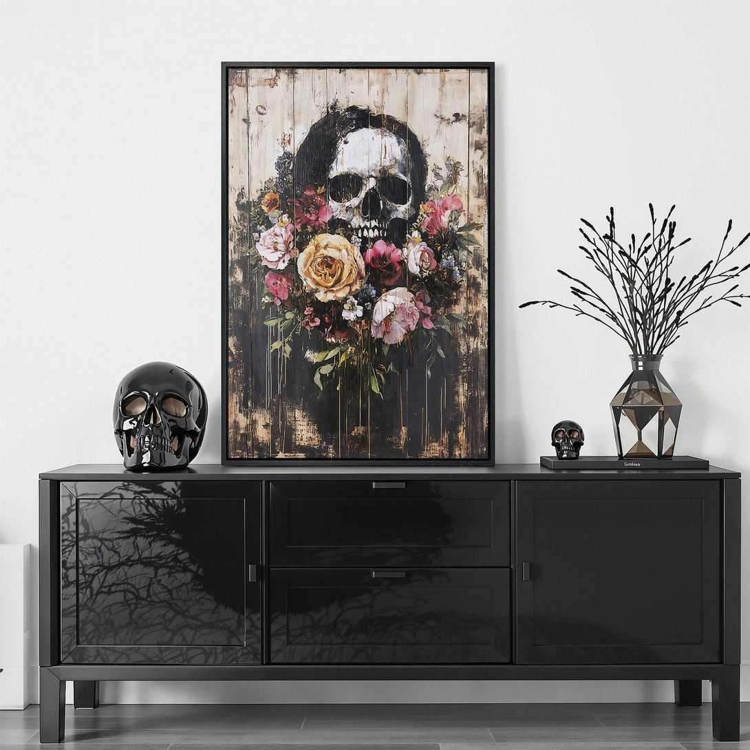 Framed Wall Art featuring a skull with floral accents. Dark, moody color palette with rustic and vintage style. Perfect for adding a unique touch to your space!