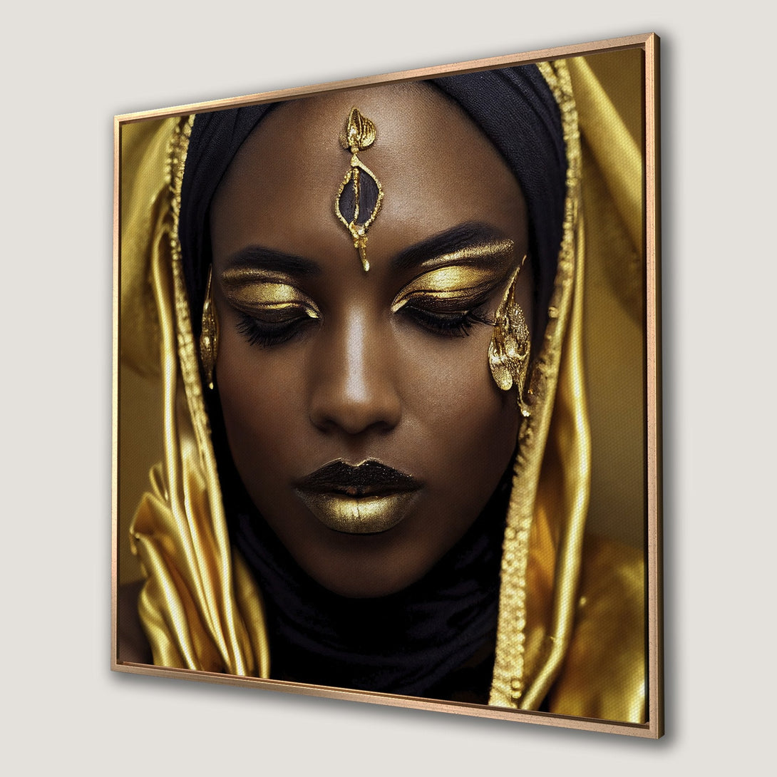 Framed Wall Art of a woman with gold makeup and head covering. Rich gold and black palette. Perfect statement piece for your home.