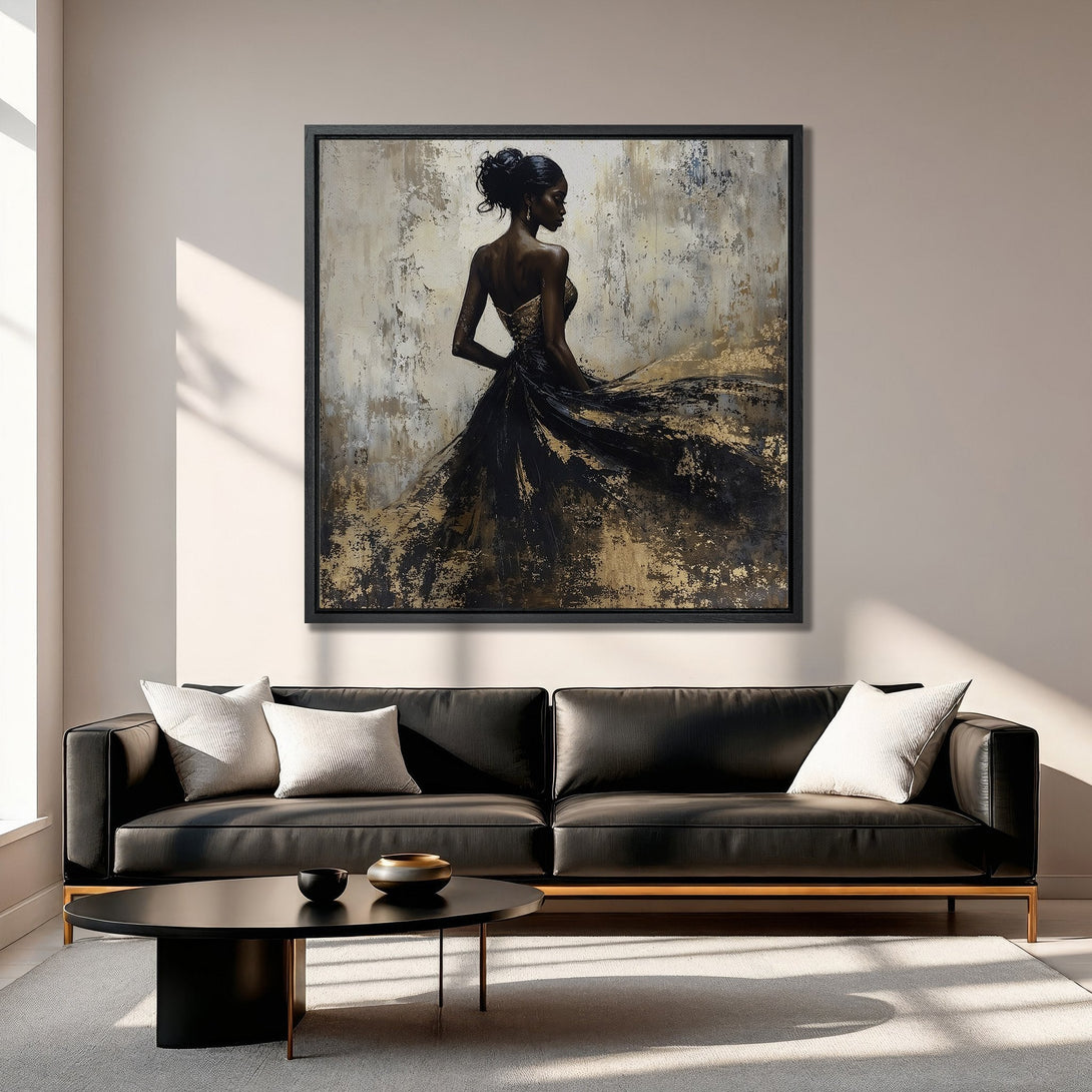 Framed Wall Art featuring an elegant woman in a black and gold dress. Abstract style with a neutral and gold color palette. Perfect for modern home decor.
