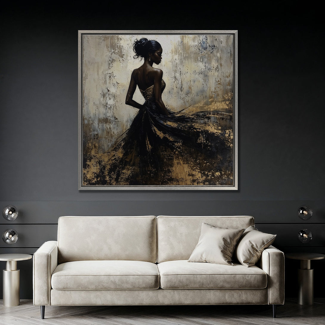 Framed Wall Art featuring an elegant woman in a black and gold dress. Abstract style with a neutral and gold color palette. Perfect for modern home decor.