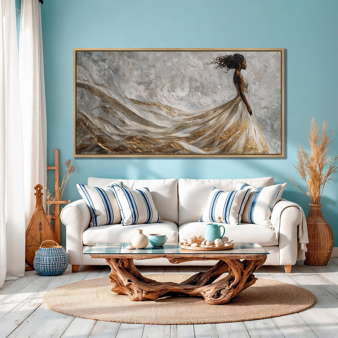 Framed Wall Art featuring an elegant woman in a flowing gown, with a neutral and gold palette, displayed in a stylish interior.