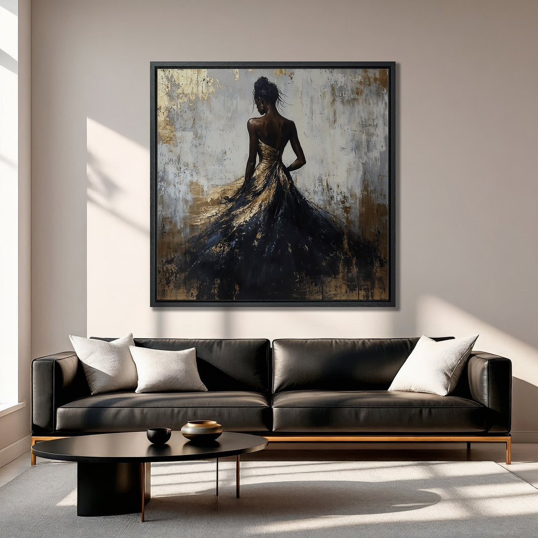 Framed Wall Art: Abstract woman in a black and gold dress, displayed in a modern living room. Stunning canvas print with neutral and metallic tones.