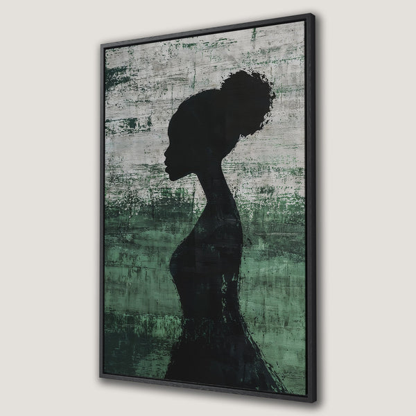 Framed Wall Art featuring a silhouette of a woman against a textured green and gray background. Modern, abstract art for your home decor.