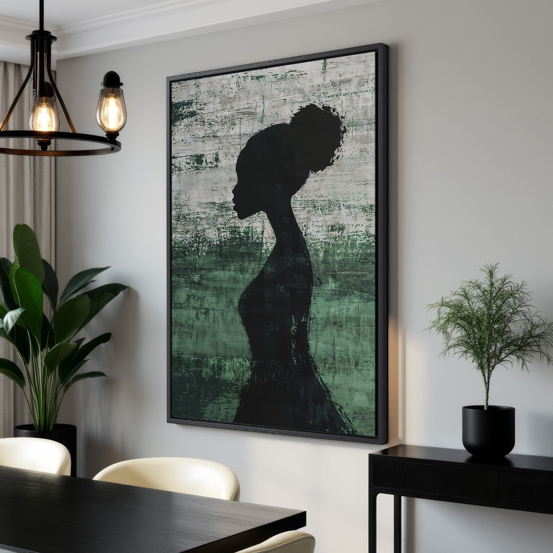 Framed Wall Art featuring a silhouette of a woman in black against a green and white abstract background. Modern art canvas print for stylish home decor.