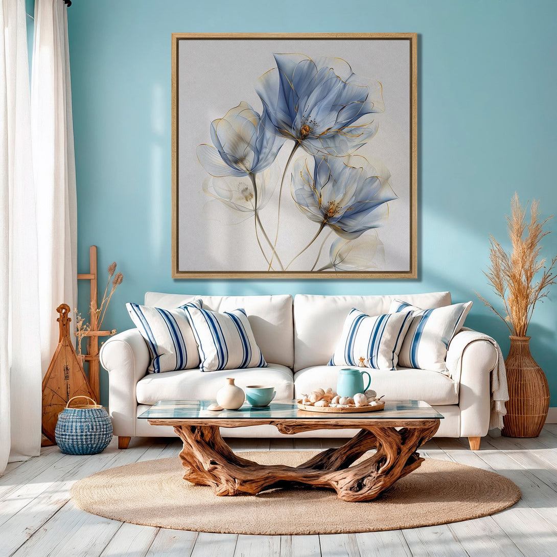 Framed Wall Art featuring abstract blue floral design. Coastal-inspired Canvas Print in a serene blue and gold color palette, perfect for living room decor.
