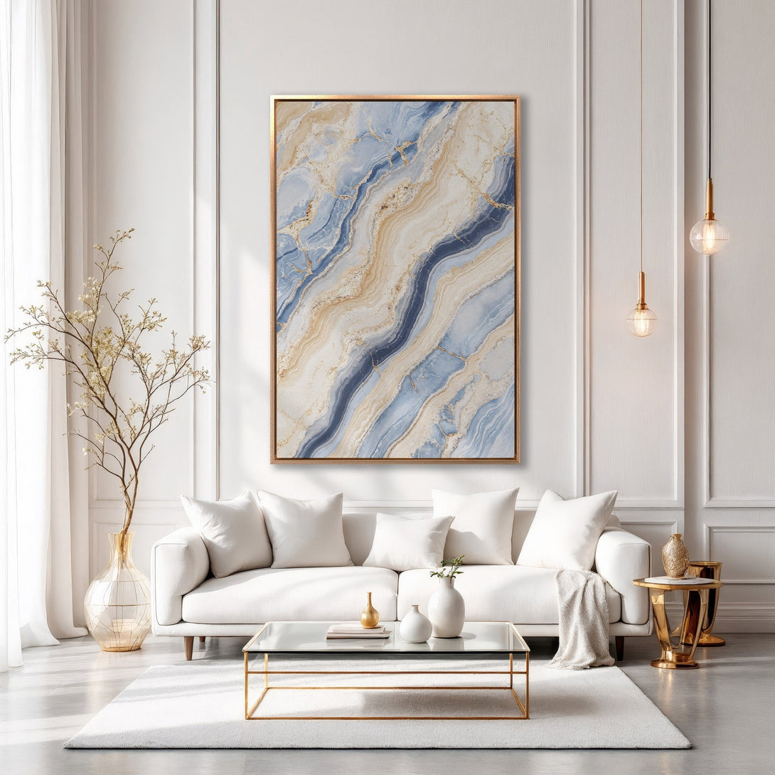 Framed Wall Art featuring a modern abstract marble design in blue, beige, and gold. Perfect for adding a touch of luxury to your living room.