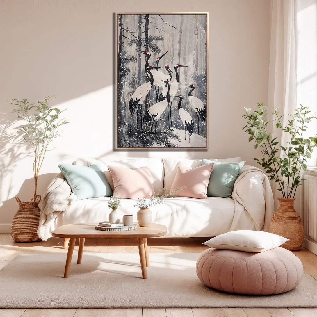 Framed Wall Art featuring elegant crane painting in grayscale with pops of red, displayed in a cozy living room. Modern art for a stylish home!